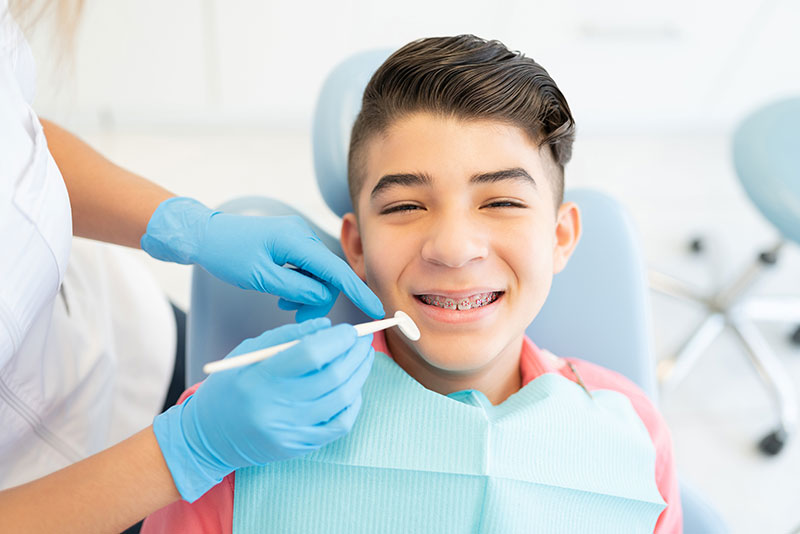 happy boy getting a dental checkup